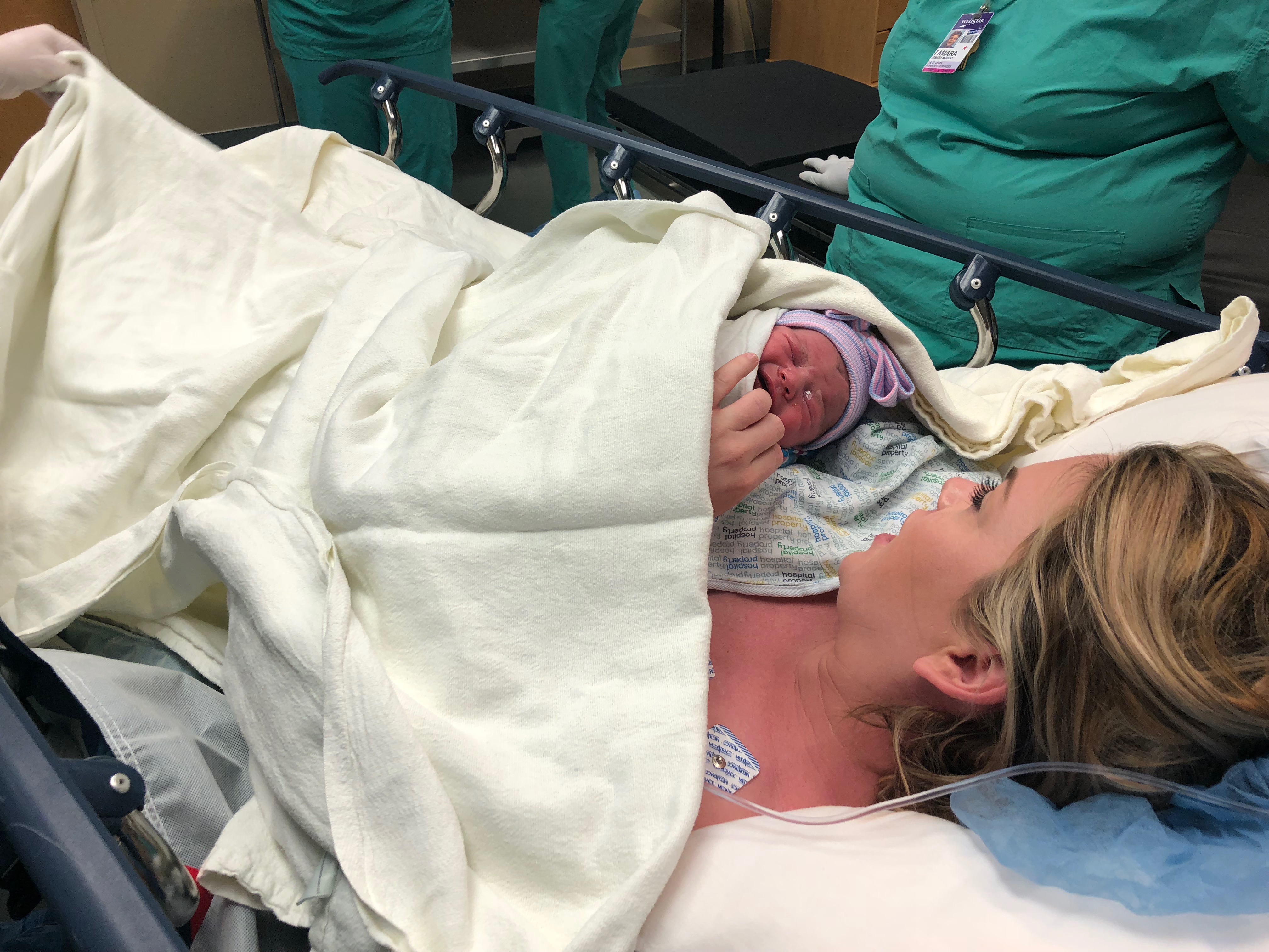 postpartum csection surgery holding newborn